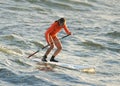 Surfers ride in sea