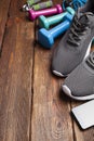 Sport symbols - sport shoes and dumbbells Royalty Free Stock Photo