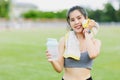 Sport teen girl relax smile drinking water wipe sweat finish exercise outdoor Royalty Free Stock Photo