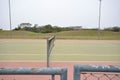 Sport tennis court in a luxury resort with weathered paintwork and safety net. Royalty Free Stock Photo