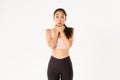 Sport, wellbeing and active lifestyle concept. Excited and amazed, thrilled asian fitness girl in activewear looking at Royalty Free Stock Photo