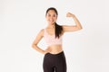 Sport, wellbeing and active lifestyle concept. Portrait of smiling slim and strong asian fitness girl, personal workout