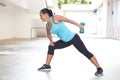 Sport woman in blue with dumbbell doing tricep back extension exercise