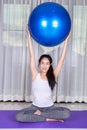 Woman doing yoga exercise with fitness ball Royalty Free Stock Photo