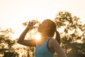 Sport woman drinking water during morning jogging Royalty Free Stock Photo