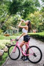 Sport woman drinking water after riding a bicycle