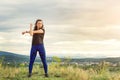 Sport woman girl outdoors. Female fitness girl doing sport exercises in summer time. Lifestyle, fitness, sport and people. Young