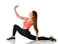 Sport woman gymnastics doing stretching fitness exercise workout and make selfie on her cellphone mobile Royalty Free Stock Photo