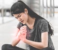 Sport woman having an injury on her wrist hand