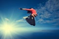 Sport woman jumping and fly over sky and sun Royalty Free Stock Photo