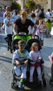 Sport woman and kids in a stroller