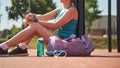 Sport woman relaxing after workout at the stadium, runner taking break after running sport. Royalty Free Stock Photo