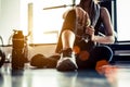 Sport woman sitting and resting after workout or exercise in fit Royalty Free Stock Photo