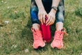 Sport woman sitting and resting after workout or exercise in fitness gym with protein shake or drinking water on floor. Relax Royalty Free Stock Photo