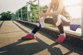 Sport woman sitting after running