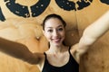 Sport woman smile at camera self picture at gym, young girl picture herself exercising fitness center Royalty Free Stock Photo