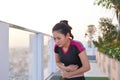 Sport woman stomachache in a park