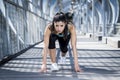 Sport woman training start up grid for running race in urban training workout