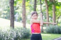 Sport woman warming up outdoors, Fitness woman doing stretch exercise stretching her arms - tricep and shoulders stretch