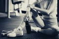 Sport woman workout at fitness center with relax and taking a rest Beautiful girl holding protein shake bottle after exercise at Royalty Free Stock Photo