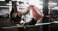 Women at the gym doing stretching exercises.