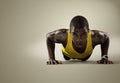 Sport. Young athletic man doing push-ups