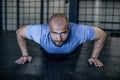 Sport. Young athletic man doing push-ups. Muscular and strong guy exercising. dressed in a sports uniform Royalty Free Stock Photo