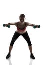 Sport young athletic woman doing exersise with dumbbells, silhou Royalty Free Stock Photo