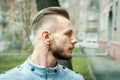 Sport young man with a modern trendy fade profile haircut for barbershop Royalty Free Stock Photo