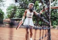 Sport young woman on tennis court Royalty Free Stock Photo