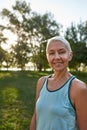 Sportive caucasian elderly woman in blurred park
