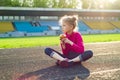 Sportive child girl eat apple Royalty Free Stock Photo