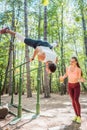 Sportive couple doing workout in outdoor gym Royalty Free Stock Photo