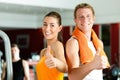 Sportive couple in gym