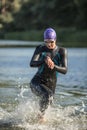 Sportive girl runs on the water Royalty Free Stock Photo
