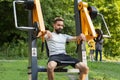 Sportive man at the open air gym of the city park Royalty Free Stock Photo
