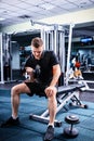 Sportive man in sportswear lifting some weights Royalty Free Stock Photo