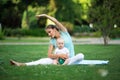 Sportive mother and little son doing yoga exercise outdoors. Sports concept Royalty Free Stock Photo