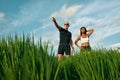 Sportive People`s Standing On Paddy Field Portrait.