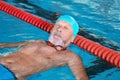 Sportive senior man in indoor pool