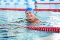 Sportive senior man in indoor pool