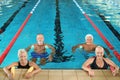 Sportive senior people doing exercises