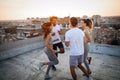 Group of athletic young people, friends in sportswear doing exercises. Sport outdoors Royalty Free Stock Photo