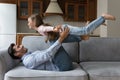 Sportive strong dad keeping balance with happy little kid girl Royalty Free Stock Photo