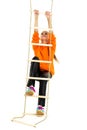 Sportive teen girl playing on rope ladder Royalty Free Stock Photo