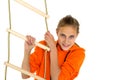 Sportive teen girl playing on rope ladder Royalty Free Stock Photo