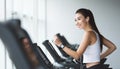 Sportive woman exercising on treadmill in gym Royalty Free Stock Photo