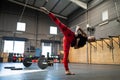 Sportive woman kicking in the air in a gym Royalty Free Stock Photo