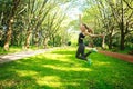 Sportive young fitness woman jumping in summer park Royalty Free Stock Photo