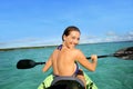 Sportive young woman rowing in a kayak Royalty Free Stock Photo